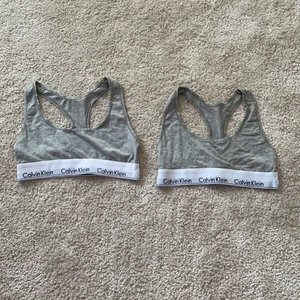Calvin Klein toppar  - Säljer mina två Calvin Klein toppar. Säljer på pga att jag inte använndet dem så mycket. De är endast använnda några få gånger så dem är i bra skick. Topparna är båda i storlek S. Nypris är 359 kr styck, säljer dem för 100 kr/styck. Frakt tillkommer! 