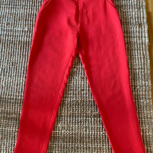 Red trousers - Comfortable skinny trousers with pockets.  Size 34. 