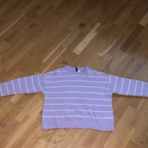 Light purple warm shirt (M 170)  - Its pretty warm, and not to short or long. And its strechy