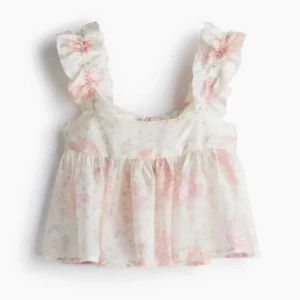 Blommig volangtop med knyt i ryggen - Populär topp från H&m!! Jättesöt verkligen och använd ett fåtal gånger💞💞 Skriv om ni har fler frågor!! Pris kan diskuteras vid snabbt köp!!💕