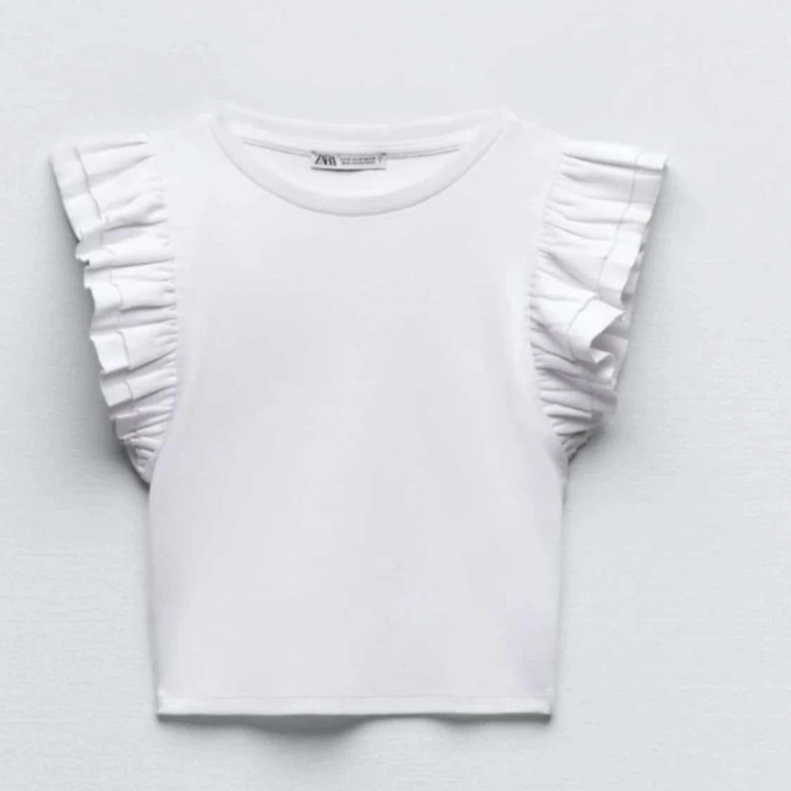 Vit volangtopp från Zara, M