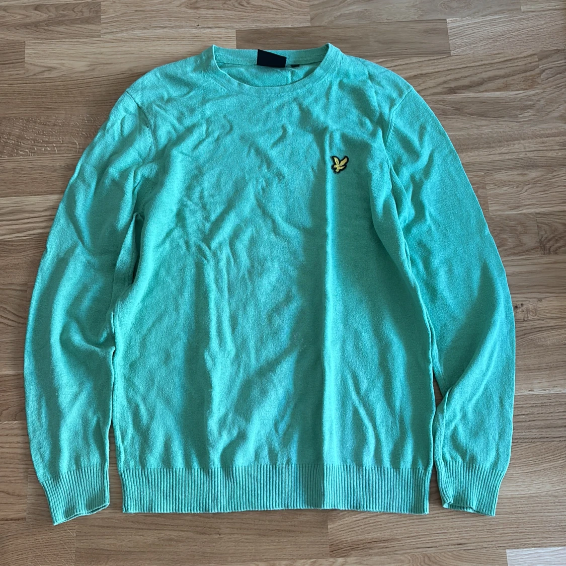 Turkos stickad tröja från Lyle & Scott