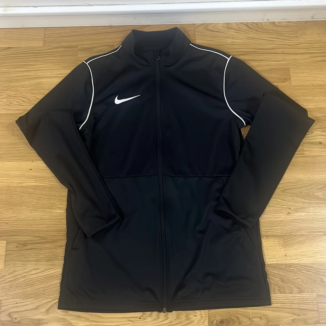 Svart Nike Dri-FIT vindjacka M