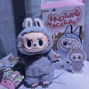 Sesame Bean Labubu  - Labubu Macaron from Pop Mart  The bags have been opened (for a video), but they’re still in original packaging.   Bought from Popmart’s official website & can show you the receipt and QR code. If you want more individual photos I’ll be happy to send them :)