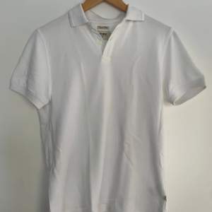 White Riley polo shirt. Barely worn. Size XS but fits S