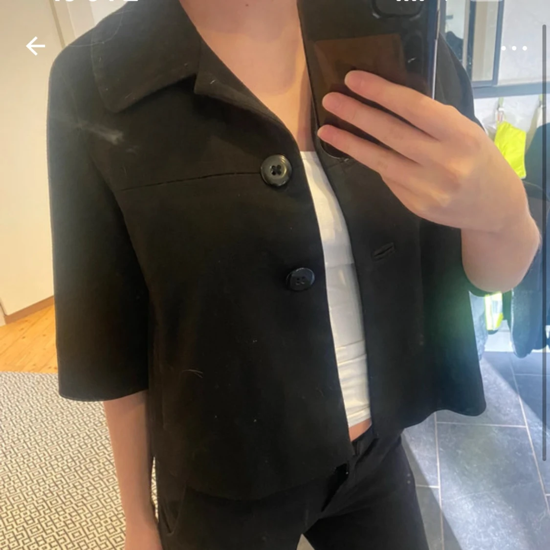 Svart kavaj med trekvartsärm