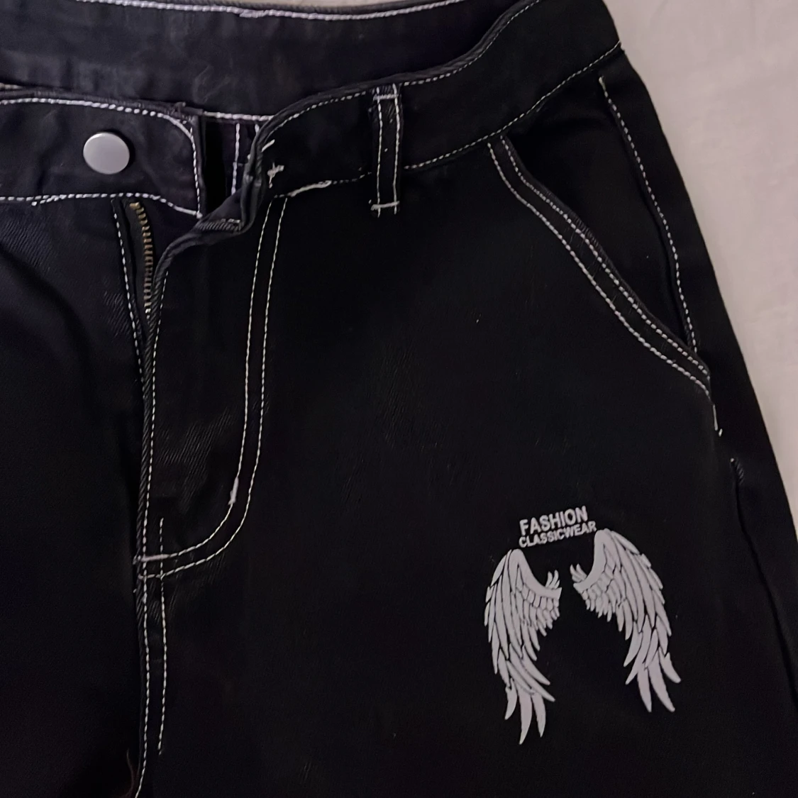 Svarta byxor med vingar - 91