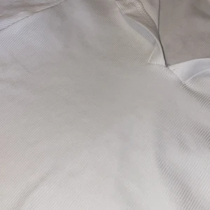 T-shirt  - Vit tight piké. 