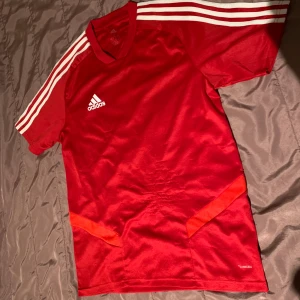 Red Adidas Sports T-shirt - Has visible marks, but no holes.
