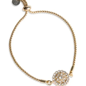 Guldarmband med glittrig detalj - Säljer ett elegant guldarmband med en justerbar kedja och en glittrig rund detalj i mitten. Detaljen är täckt av små, gnistrande stenar som ger en lyxig känsla. Perfekt för att piffa upp vilken outfit som helst, oavsett om det är till vardags eller fest. Märket är Pearls for girls. det är i bra skick men har tecken på användning