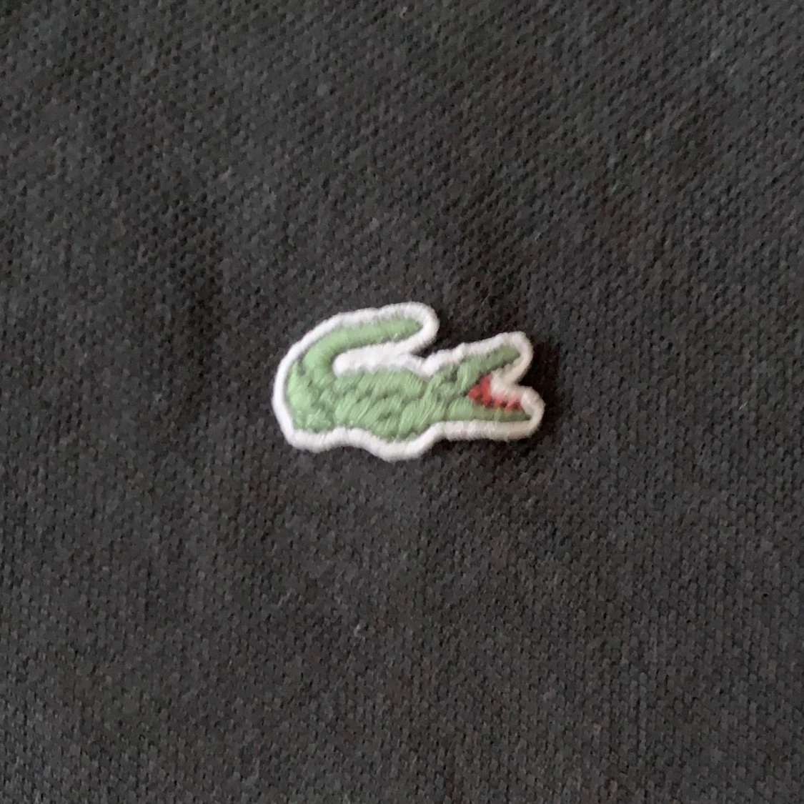 Svart pikétröja från Lacoste - 91