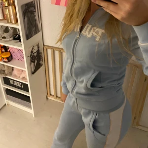A Puma sweatsuit  - Cute, comfortable yearly 2000s style sweatsuit. Light blue color. Good quality and fits well for 5’5-5’7 height (150-170cm). Fits well for xs and s. Can also fit for M