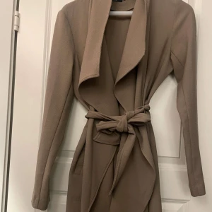 Beige kappa  - Använd fåtalet gånger 