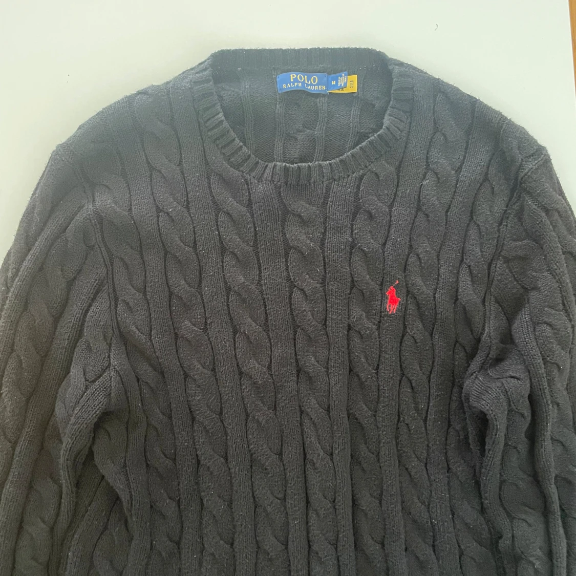 Cable knitted polo tröja 