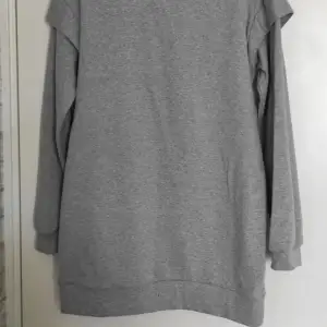Oanvönd grå tröja