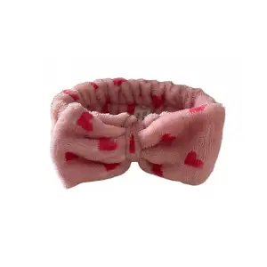 rosa hårband med rosett. perfekt att använda när man sminkar sig! <3