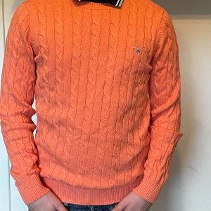 Gant stickad tröja - En orange stickad Gant tröja i storlek S.
