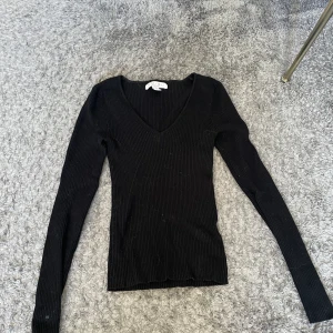 Tröja - Långärmad, tight tröja svart