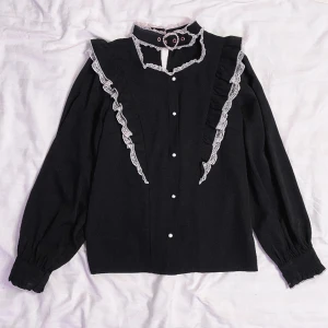 Rojita blus  - The iconic heart buckle blouse in black! It’s in good condition besides minor discolouration on the lace of the collar (see last photo). It’s barely noticeable tho! 