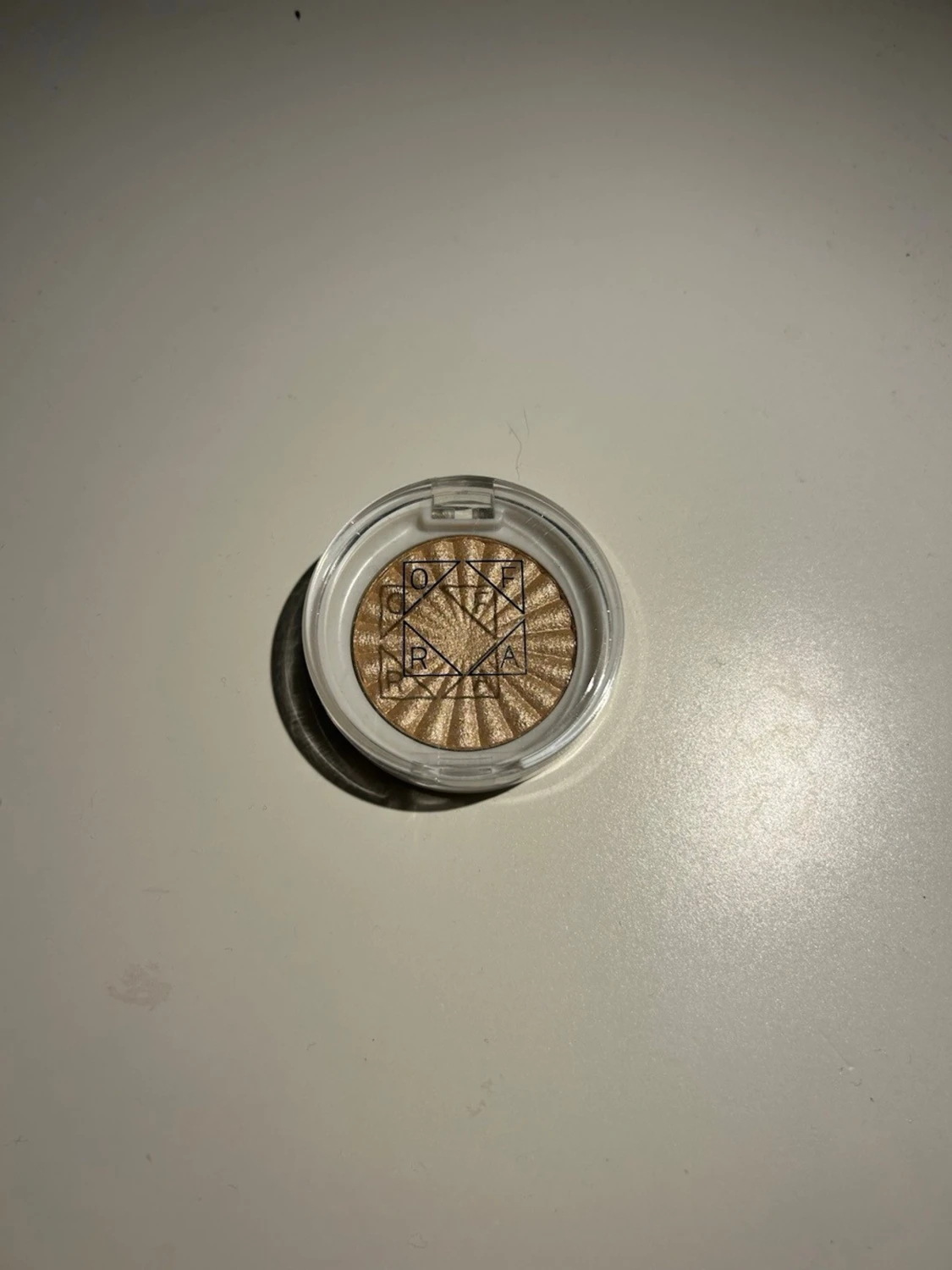 Ofra highlighter i guldton