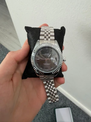 Black and Silver Rollie - As new, send an offer