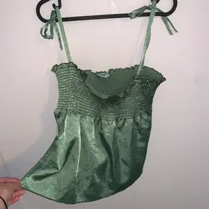 Super cute satin green tank top with a stretchy top. Fits a size small- medium and is in perfect condition 