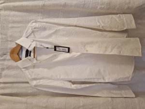 White shirt. New! - I never got the opportunity to use this. Tag still left.