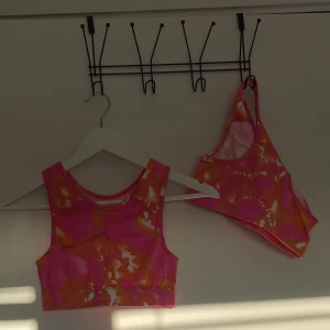 Sport bh - Rosa/orange sport bb från new body. Aldrig använd. Säljer två likadana.