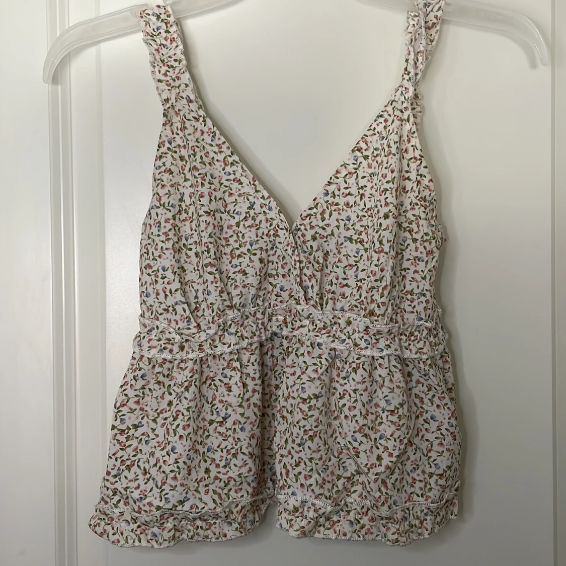 En blommig volangtopp i storlek XS/S❤️👚