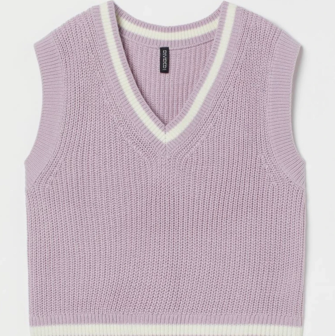 Ljuslila stickad vest 