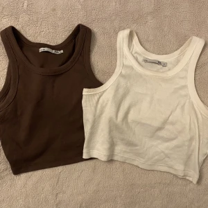 Tank top  - Vit och brun tank top från lager157 i strl S. Täcker ungefär halva magen. Båda för 50kr eller 30kr/styck. 