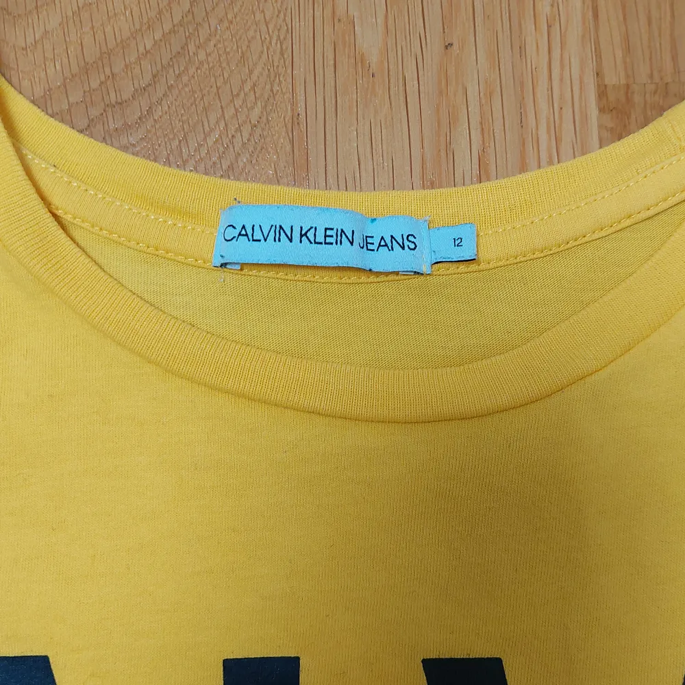 Yellow Calvin Klein boys t-shirt. . T-shirts.