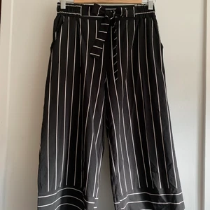 Black shorts with white stripes in very good condition. - Black shorts with white stripes in very good condition. Bought in France 2 years back.   Size 36