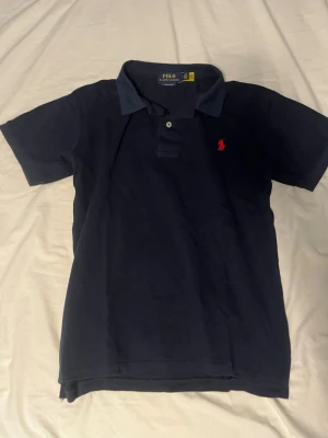 Ralph lauren pike - Ralph lauren pike marinblå storlek S slimfit passform mycket bra skick.