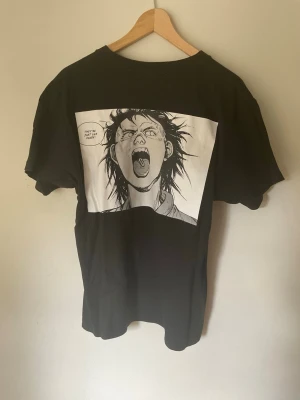 Akira Supreme Manga T-Shirt - Size Medium - Akira Supreme T-Shirt. Size medium, regular men’s medium fit. Great condition, no flaws or damage. Size measurements are L - 65cm, W - 52cm. Buyer pays for all shipping costs. All items sent with tracking number.   No swaps, no trades, no offers.  No 100 questions from 14 year olds either, it’s a cotton tee, it’s cheap, buy it!