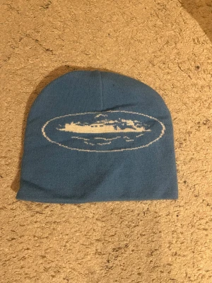 En blå  mössa  - Jag säljer / byter den här mössan 