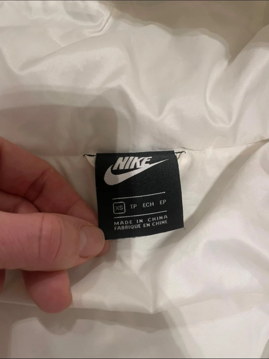 Vit pufferjacka från Nike XS - 1