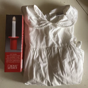 Lucia-linne från Lindex med tärnljus Konstsmidje - Lucia-linne storlek 98/104 med tillhörande tärnljus från Konstsmide (LED).