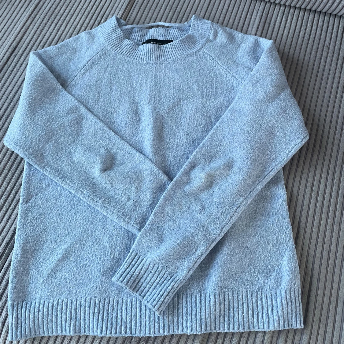 Ljusblå stickad tröja med rund hals