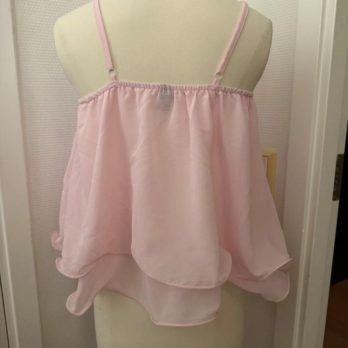 Ljusrosa volangig linnetopp - 1