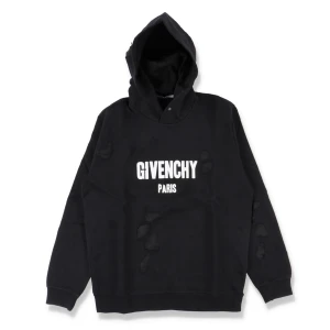 Svart Givenchy hoodie med tryck - Svart hoodie från Givenchy med vit logga och texten PARIS på bröstet. Tröjan har huva, långa ärmar och en relaxed passform. Distressed detaljer ger en cool och edgy vibe. Perfekt för dig som gillar streetwear och exklusiva märken. För mer bilder är det bara att höra av er!