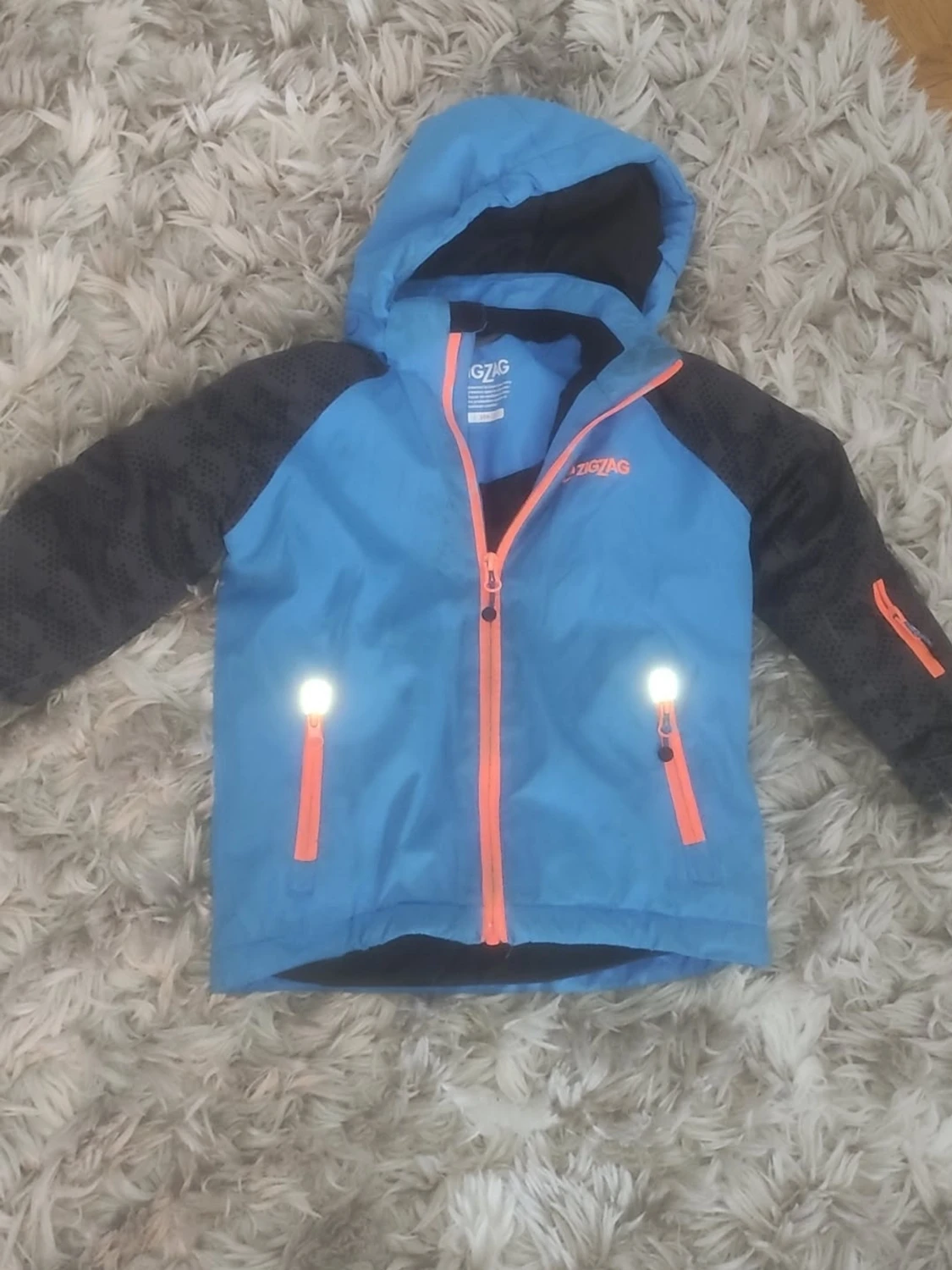 Blå vindjacka från ZigZag med huva