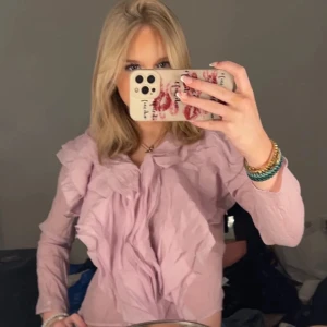 Rosa/lila blus  - Rosa/lila blus storlek xs 