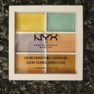 NYX Color Correcting Concealer Palette - NYX Professional Makeup Color Correcting Concealer palett. Innehåller sex olika färgkorrigerande nyanser för att jämna ut hudtonen och dölja ojämnheter. Den ser krämig ut men sprider sig lätt på huden, men tyvärr passar den inte på min hudfärg.   Köpt nyligen. Endast testat med sminkborste.