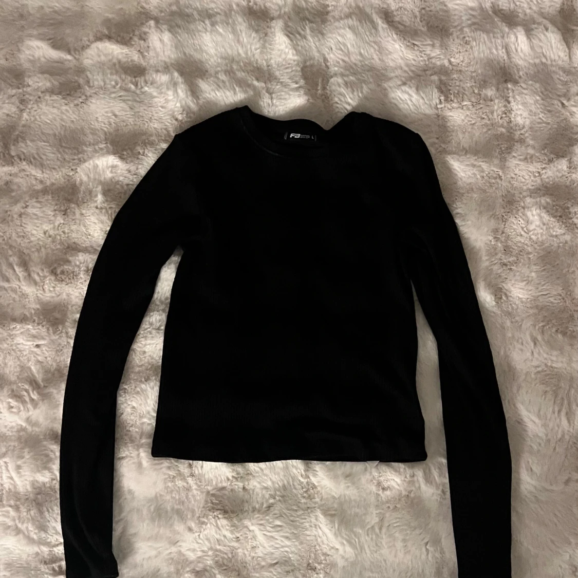 Svart ribbad tröja från FB Sister