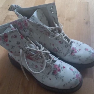 Floral Dr. Martens  - Haven't worn these since high school (circa 2012) but if you are feeling your mid 2010' soft grunge tumblr fantasy then these are for you!