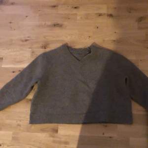 100% wool sweater , on a small sized person it’s loose or little oversized