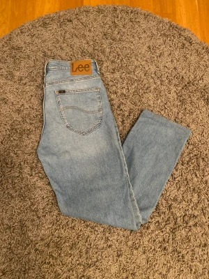 Lee jeans - Ljusblåa lee jeans, aldrig använda.