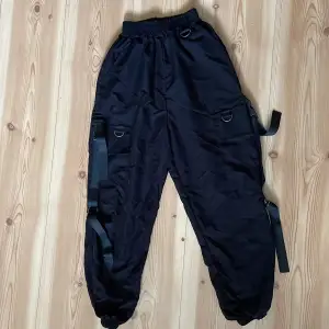 Black cargo pants with side pockets , no damage in new shape