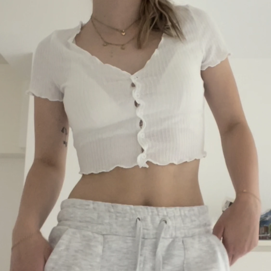 Kortare topp med knappar